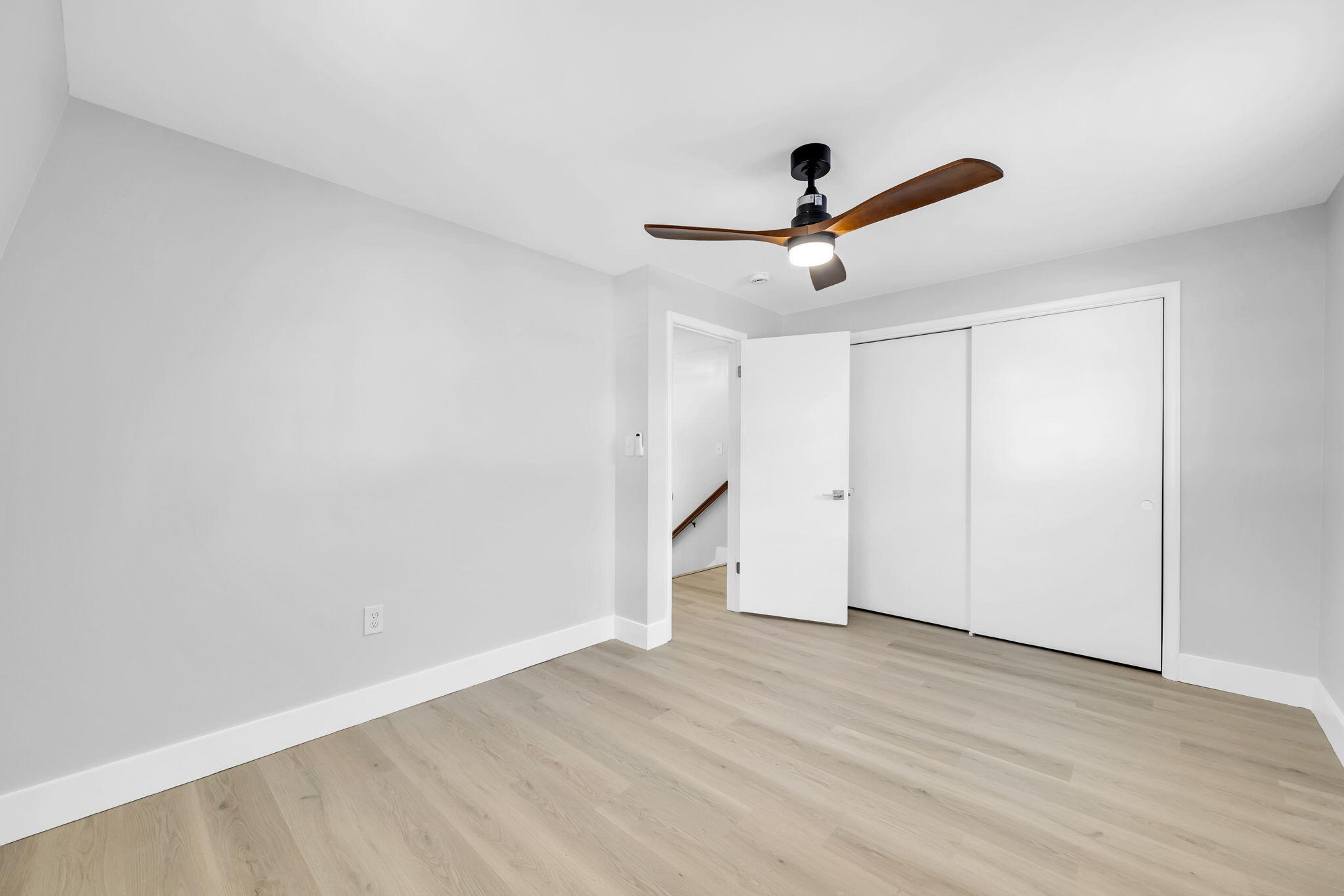 34 Hickory Avenue Shalimar, FL 32579 - Photo 26 of 57 a view of a room with wooden floor and ceiling fan