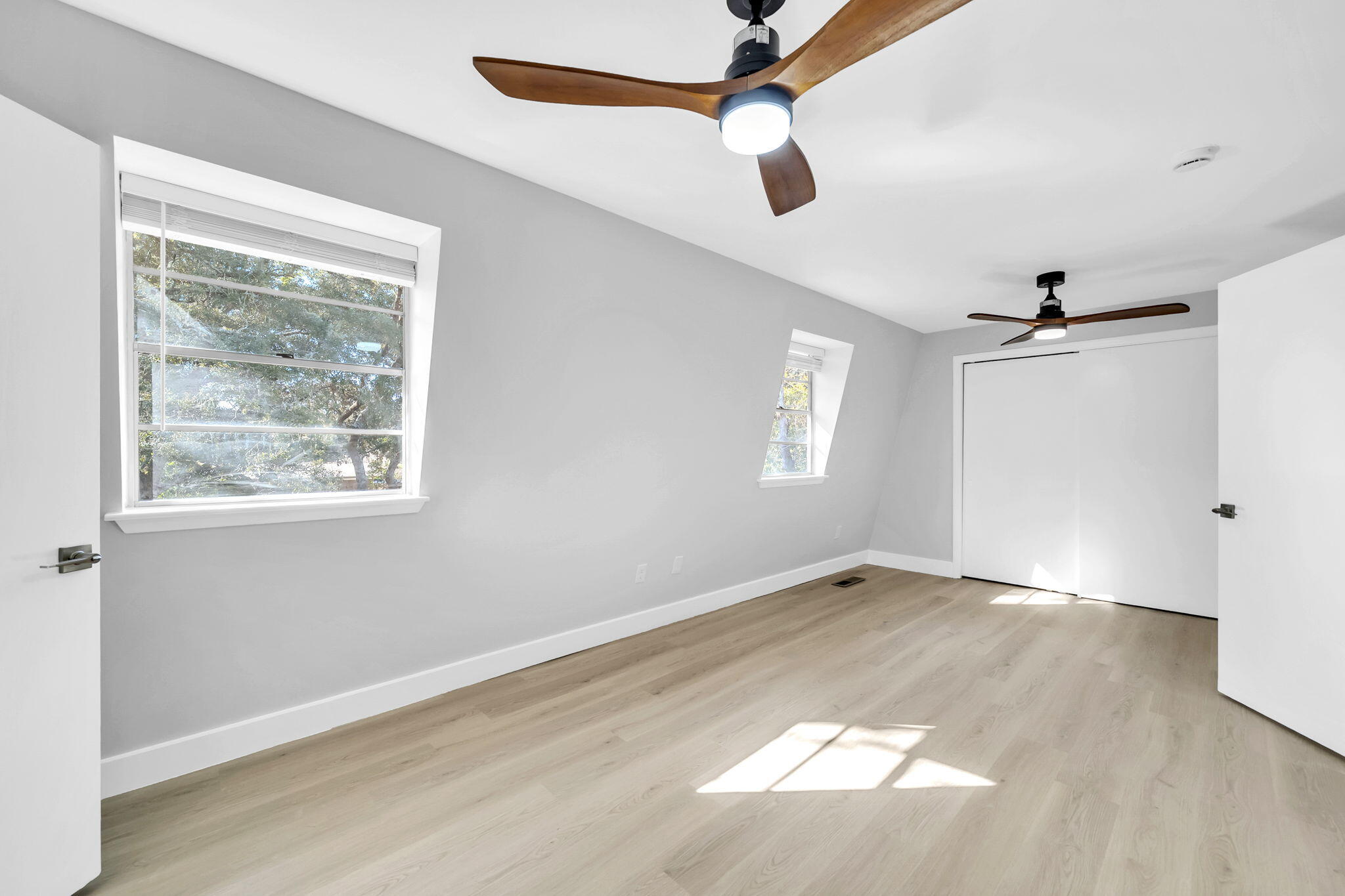 34 Hickory Avenue Shalimar, FL 32579 - Photo 29 of 57 wooden floor in an empty room with a window