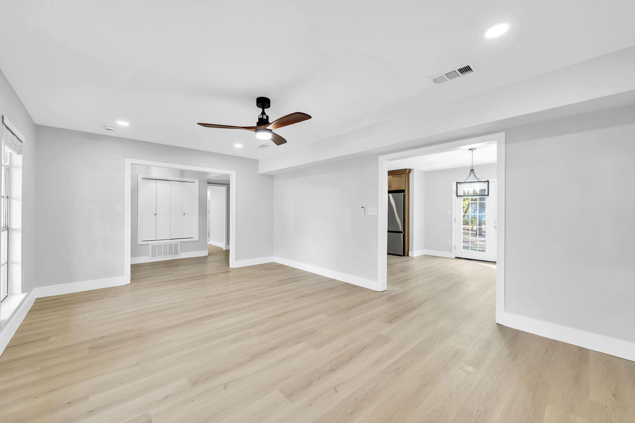 34 Hickory Avenue Shalimar, FL 32579 - Photo 9 of 57 a view of an empty room with window and wooden floor