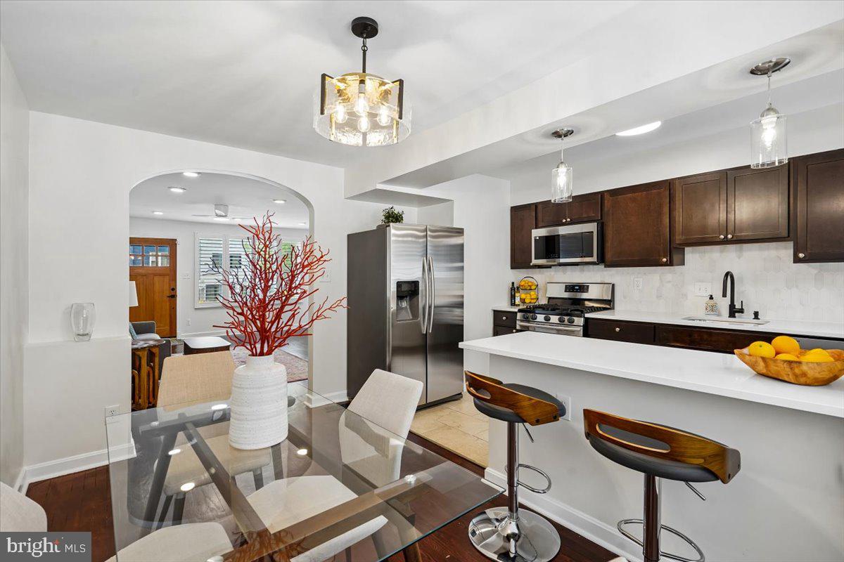2223 16th Street Northeast Washington, DC 20018 - Photo 1 of 39 a large kitchen with a table and chairs