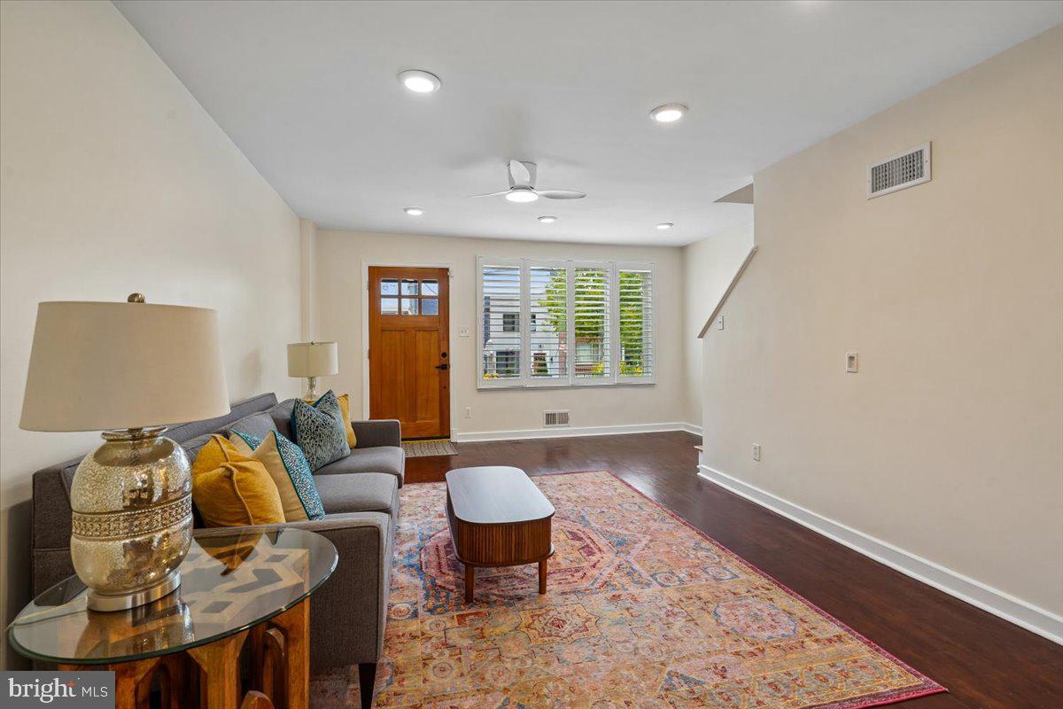 2223 16th Street Northeast Washington, DC 20018 - Photo 11 of 39 a living room with furniture and a window