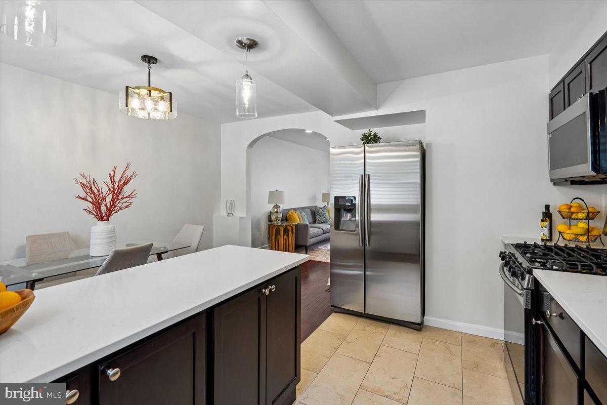 2223 16th Street Northeast Washington, DC 20018 - Photo 15 of 39 a kitchen with granite countertop a refrigerator and a sink
