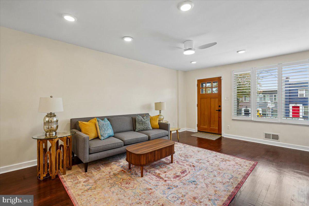 2223 16th Street Northeast Washington, DC 20018 - Photo 2 of 39 a living room with furniture and a rug