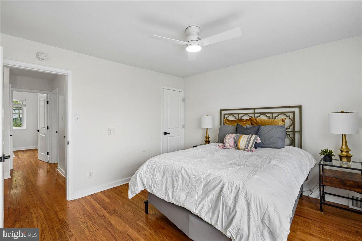 2223 16th Street Northeast Washington, DC 20018 - Photo 22 of 39 a bedroom with a bed and wooden floor