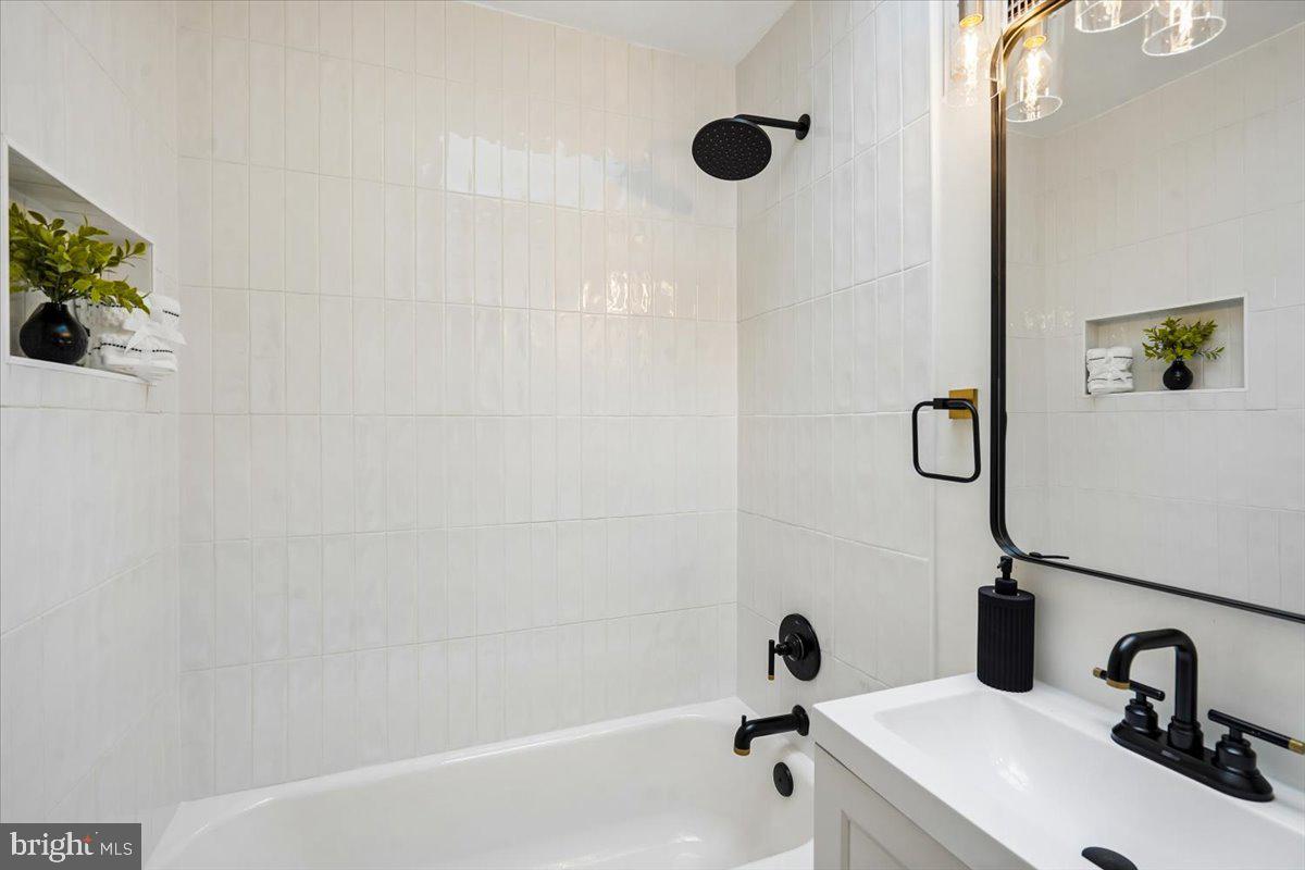 2223 16th Street Northeast Washington, DC 20018 - Photo 24 of 39 a bathroom with a sink and a shower
