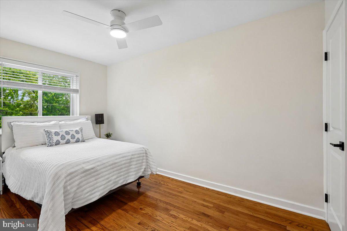 2223 16th Street Northeast Washington, DC 20018 - Photo 25 of 39 a bedroom with a bed and wooden floor