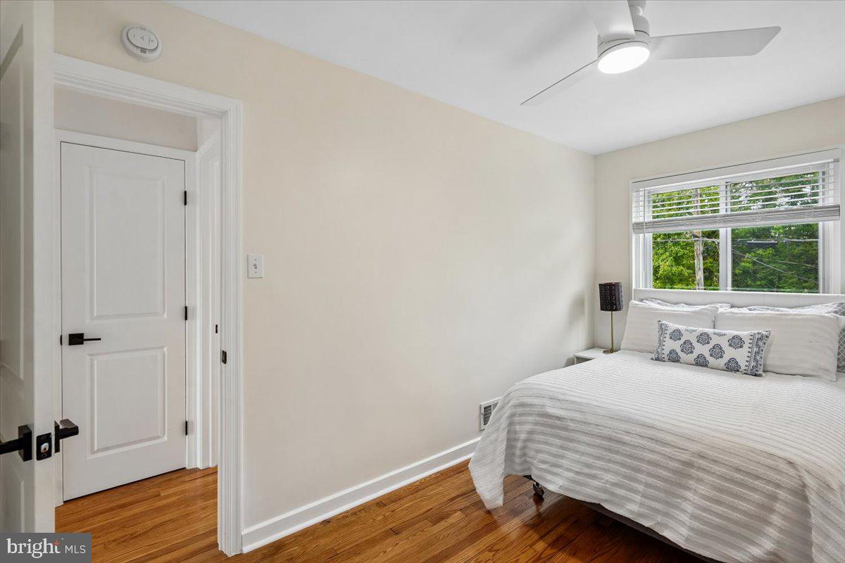 2223 16th Street Northeast Washington, DC 20018 - Photo 26 of 39 a bedroom with a bed and wooden floor