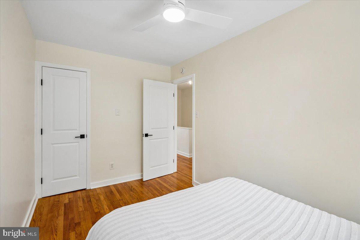 2223 16th Street Northeast Washington, DC 20018 - Photo 27 of 39 a bedroom with a bed and a couch