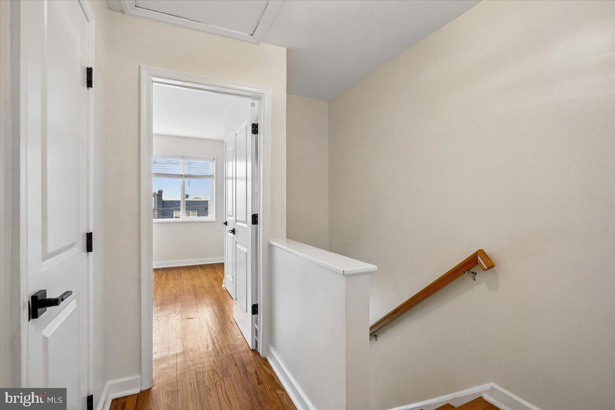 2223 16th Street Northeast Washington, DC 20018 - Photo 28 of 39 a view of a hallway with wooden floor and staircase