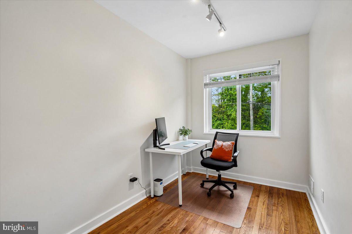 2223 16th Street Northeast Washington, DC 20018 - Photo 29 of 39 a view of a workspace with furniture and a window