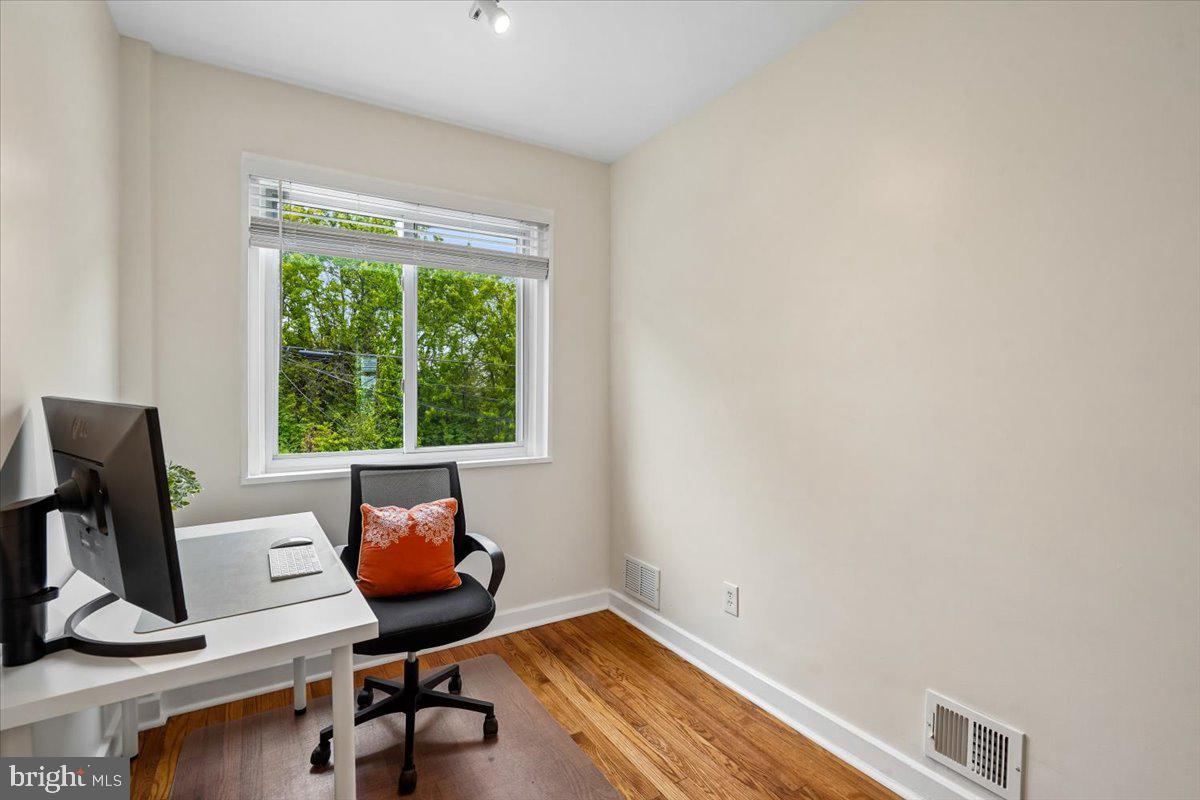 2223 16th Street Northeast Washington, DC 20018 - Photo 30 of 39 a view of a workspace with furniture and a window