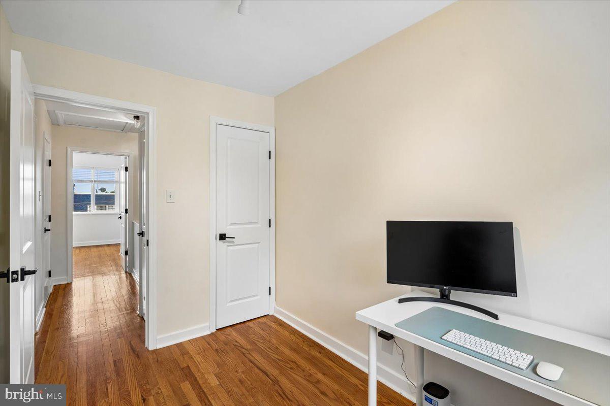 2223 16th Street Northeast Washington, DC 20018 - Photo 31 of 39 a room with a bed and a flat screen tv