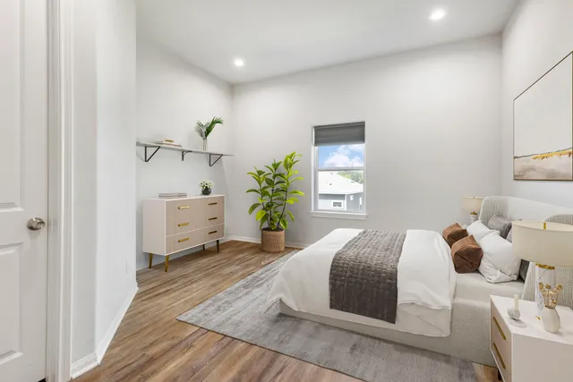 a bedroom with a bed and a window