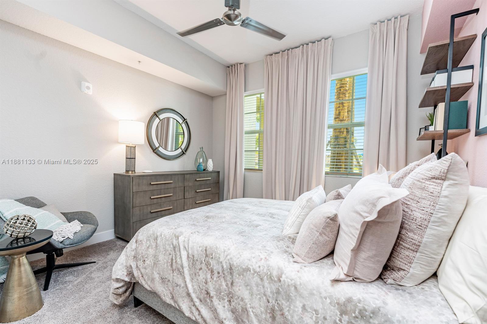 9155 Northwest 57th Street, Unit 103 Tamarac, FL 33351 - Photo 14 of 32 a bedroom with a bed and a window