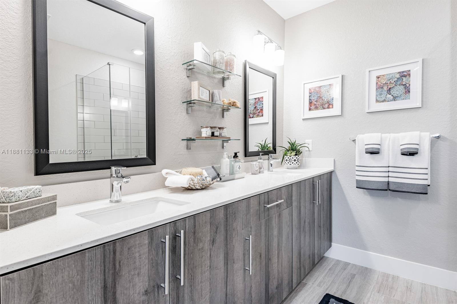 9155 Northwest 57th Street, Unit 103 Tamarac, FL 33351 - Photo 21 of 32 a bathroom with a sink and a mirror