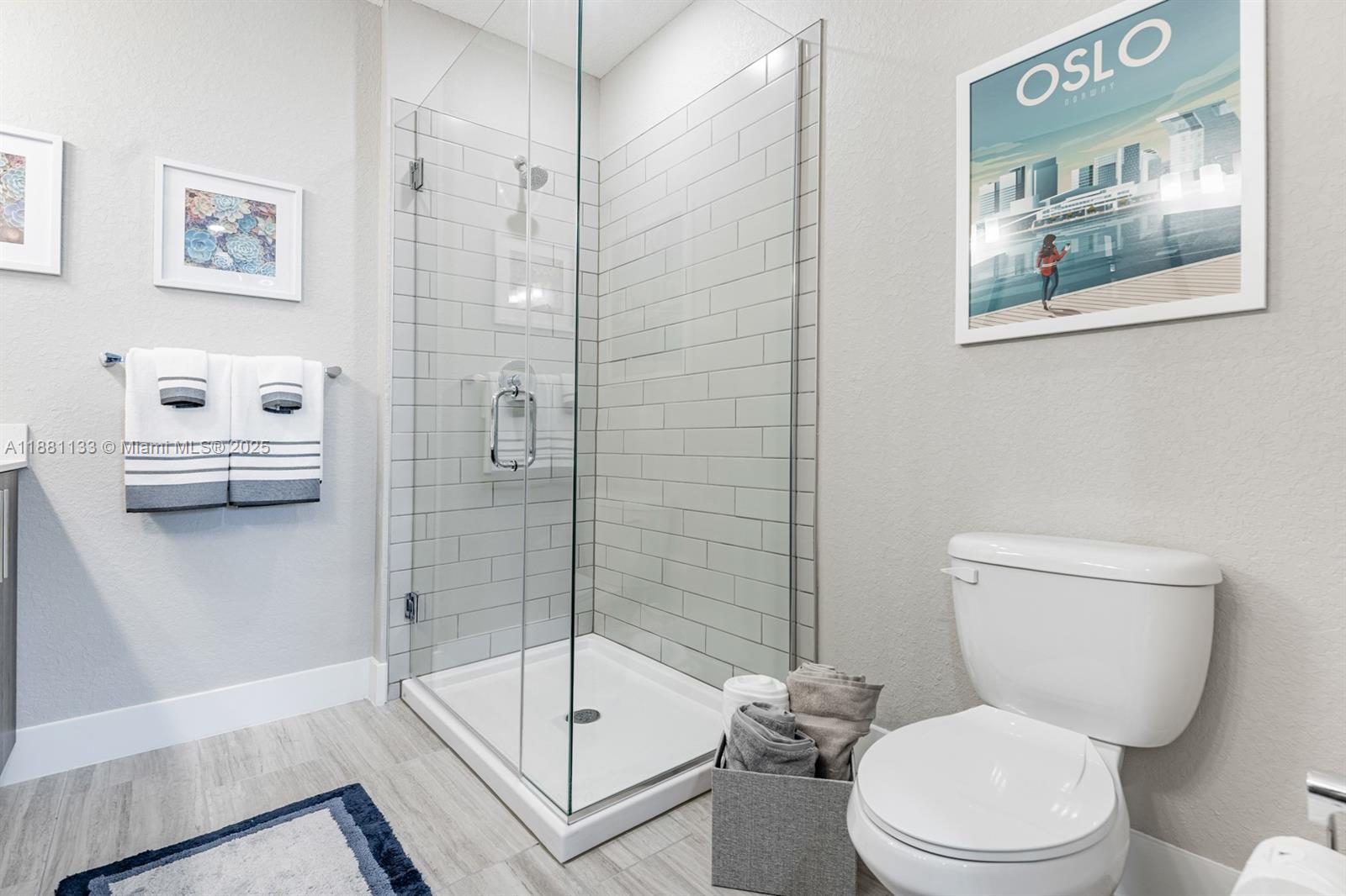 9155 Northwest 57th Street, Unit 103 Tamarac, FL 33351 - Photo 22 of 32 a bathroom with a toilet and a shower