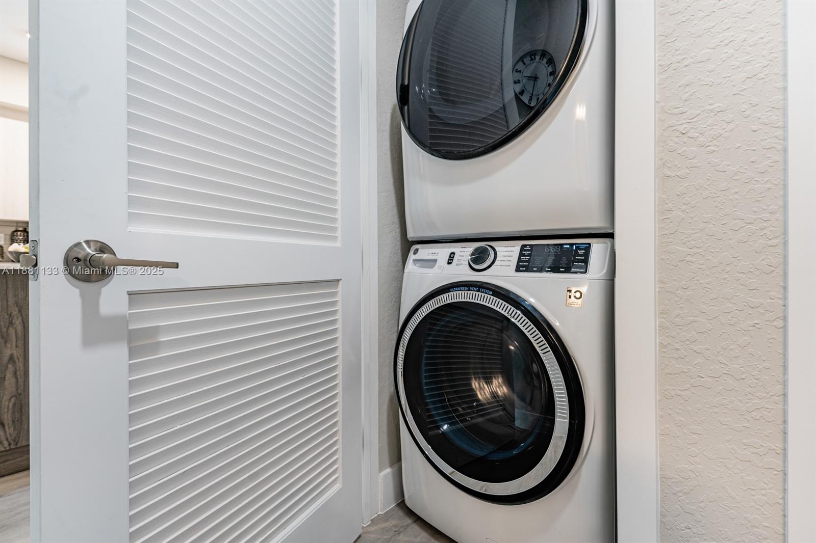 9155 Northwest 57th Street, Unit 103 Tamarac, FL 33351 - Photo 23 of 32 a utility room with dryer and washer