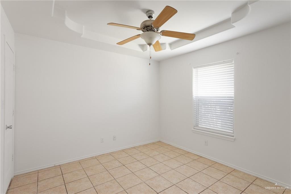 705 West Bronze Drive, Unit 1 Pharr, TX 78577 - Photo 11 of 11 an empty room with a window and a fan