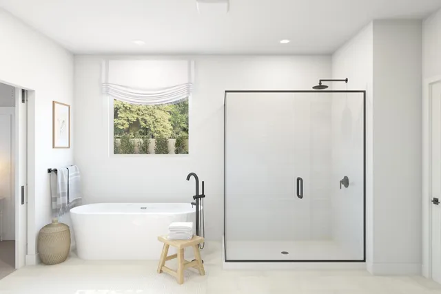 a bathroom with a tub and a shower