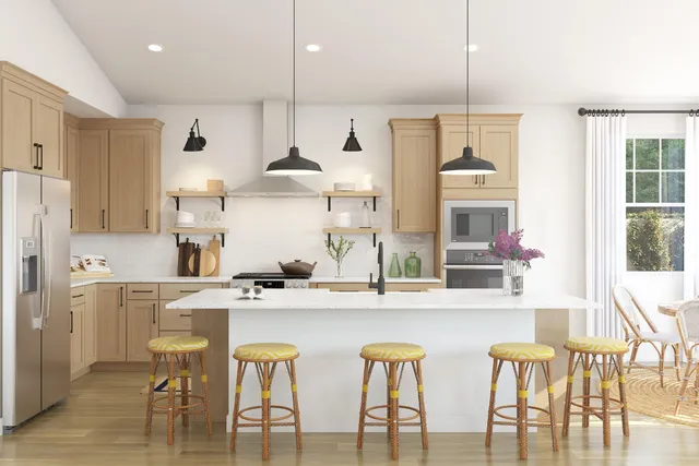 a kitchen with stainless steel appliances a dining table chairs and white cabinets