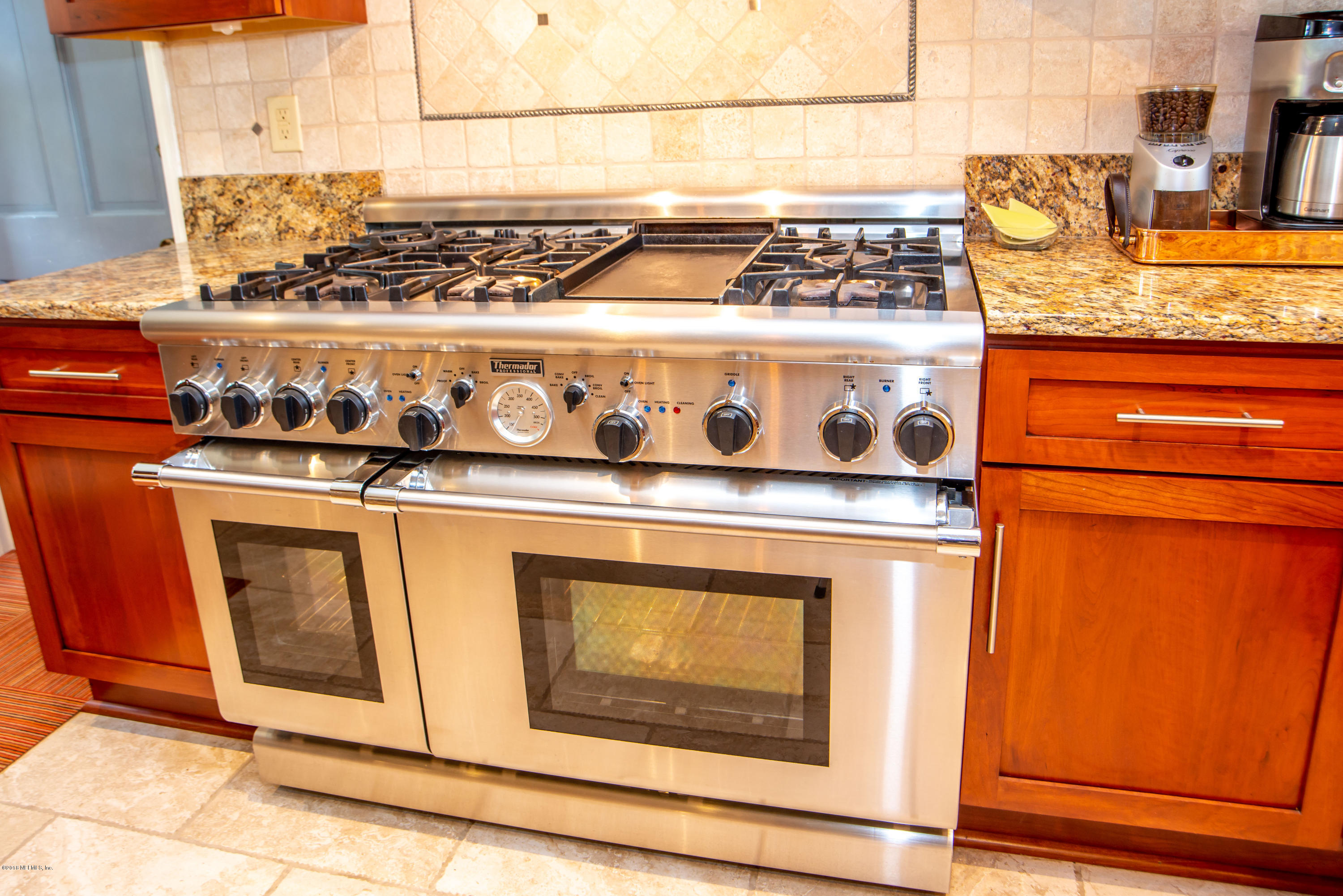1429 Mayfair Road Jacksonville, FL 32207 - Photo 11 of 35 a stove top oven sitting inside of a kitchen