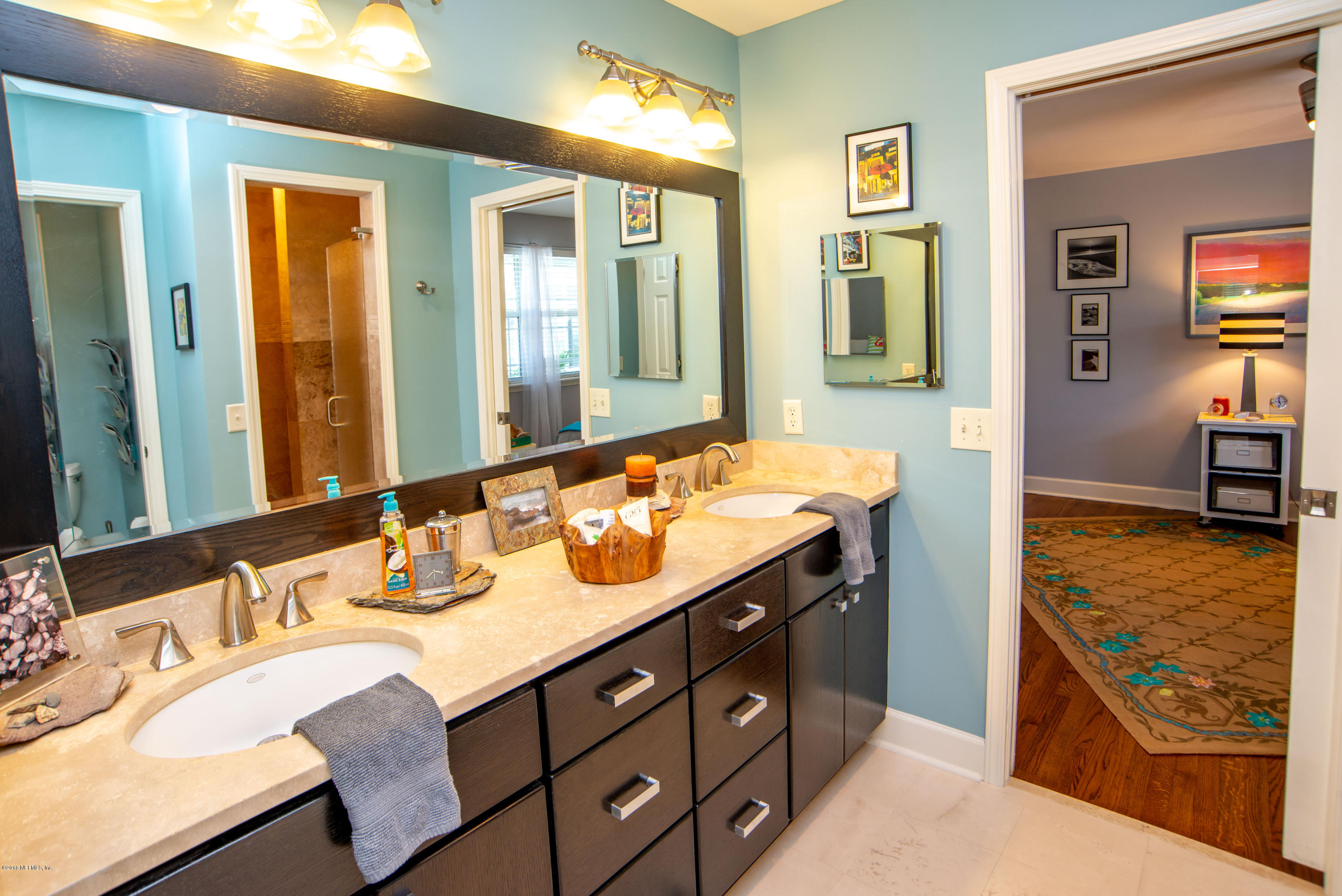 1429 Mayfair Road Jacksonville, FL 32207 - Photo 19 of 35 a bathroom with a sink double vanity and a mirror