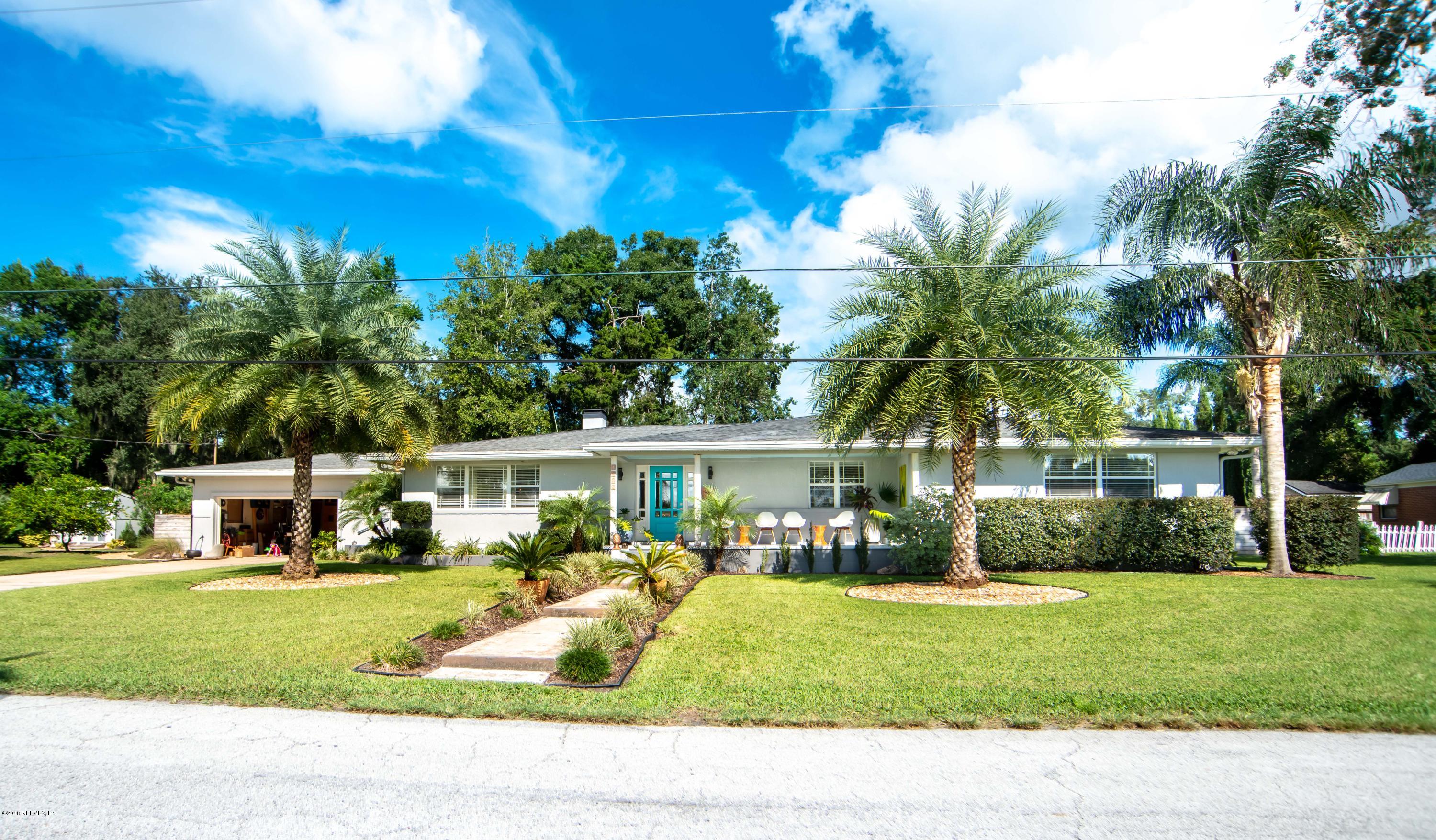 1429 Mayfair Road Jacksonville, FL 32207 - Photo 2 of 35 a house view with swimming pool and garden
