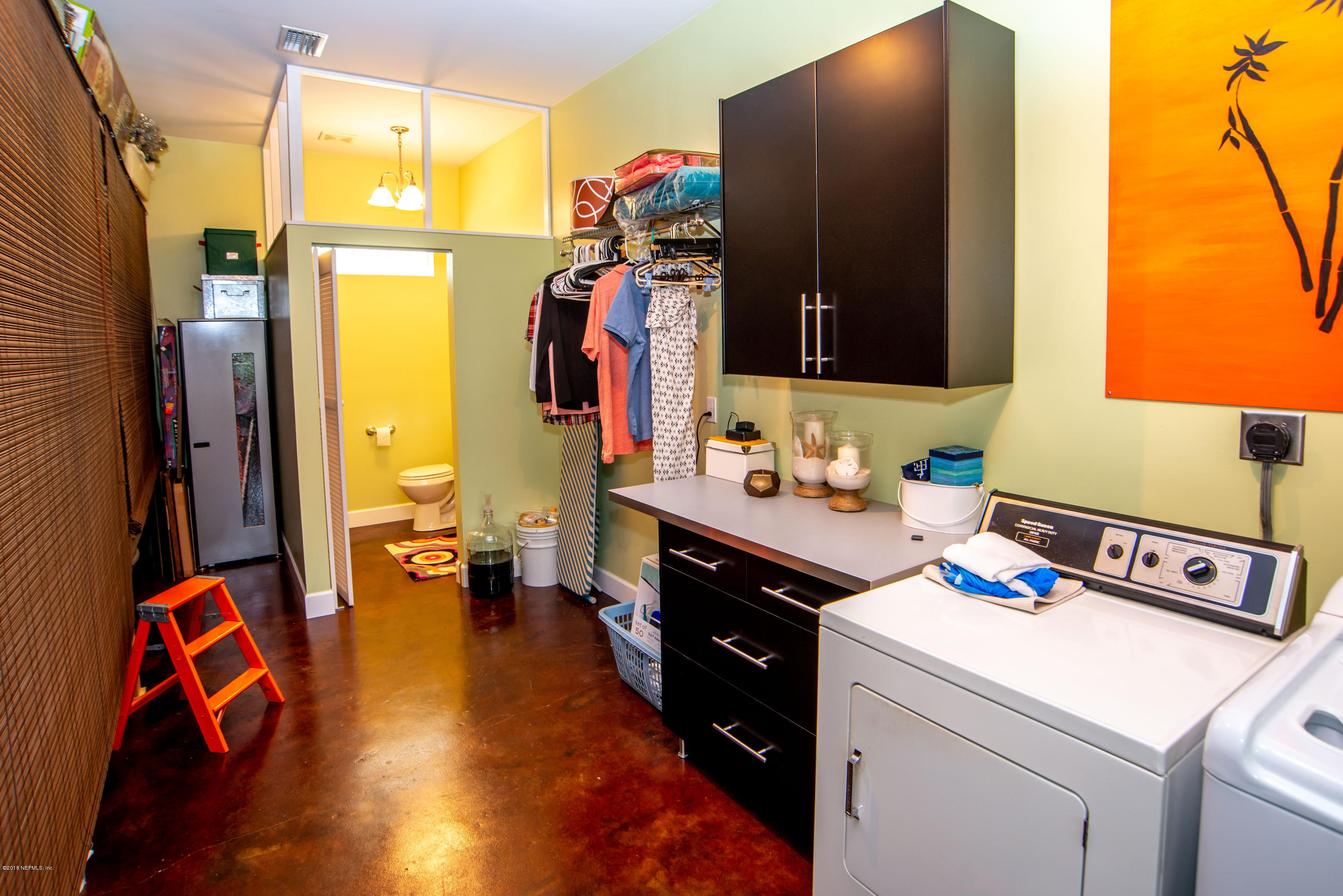 1429 Mayfair Road Jacksonville, FL 32207 - Photo 31 of 35 a view of walk in closet with clothes and shoes
