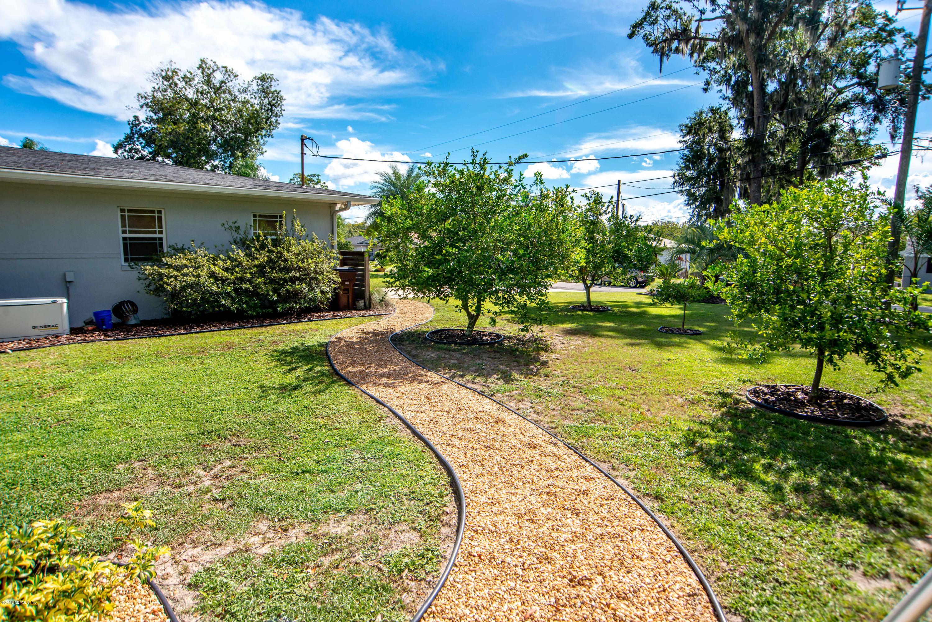 1429 Mayfair Road Jacksonville, FL 32207 - Photo 34 of 35 a view of a backyard with plants and a garden