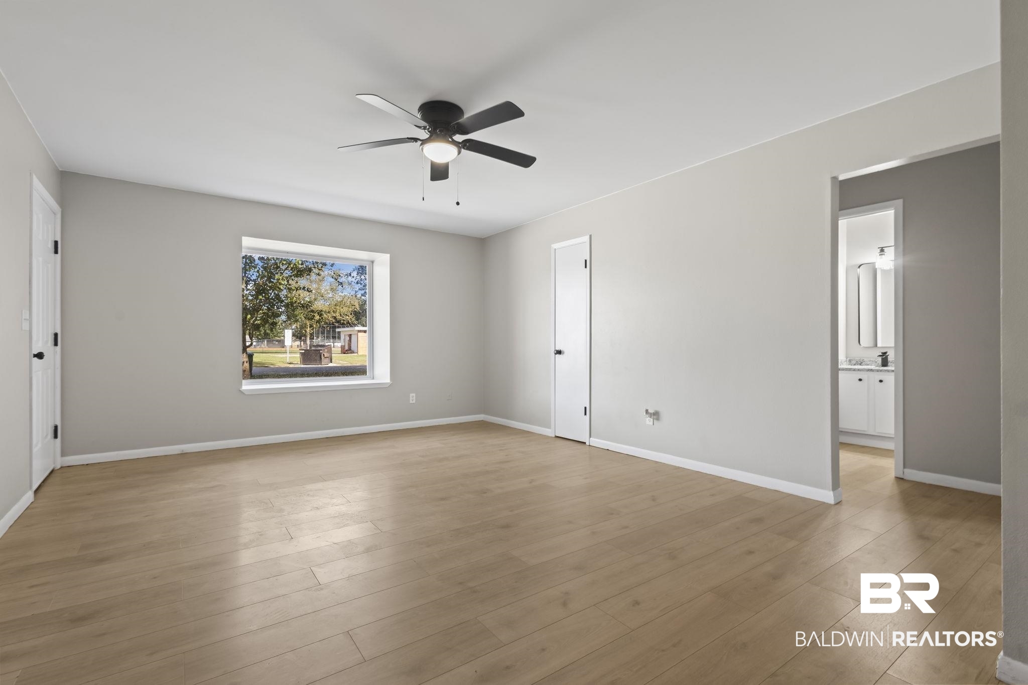 309 West Roosevelt Avenue Foley, AL 36535 - Photo 20 of 60 Unfurnished room featuring ceiling fan and light hardwood / wood-style floors