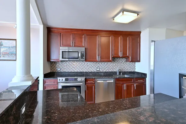 a hallway with a table and chairs