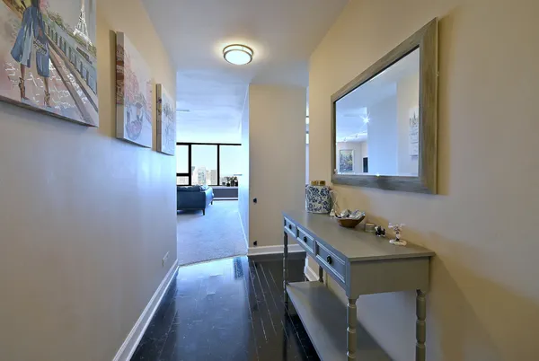 a spacious bedroom with a bed and a dresser