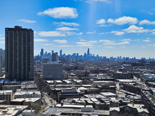 a view of a city with tall buildings