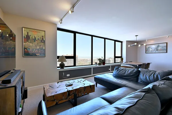 a living room with furniture and a large window