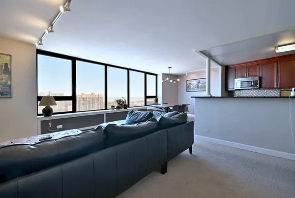 a living room with a couch and a large window