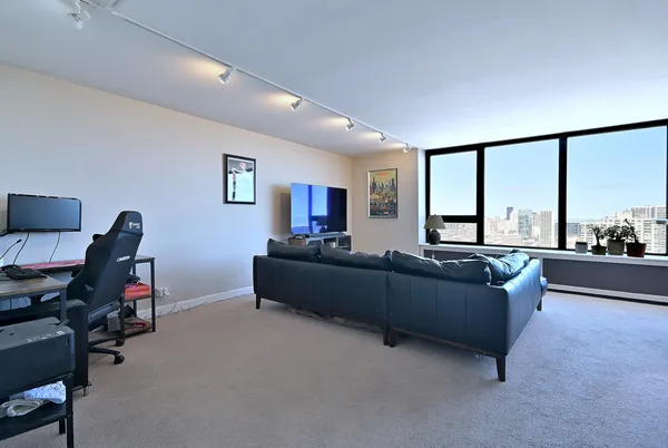 a living room with furniture and a large window