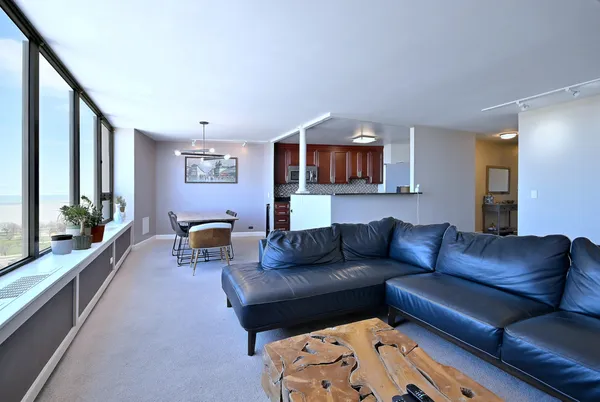 a living room with furniture and a large window