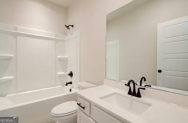 a view of a room with wooden floor and cabinet