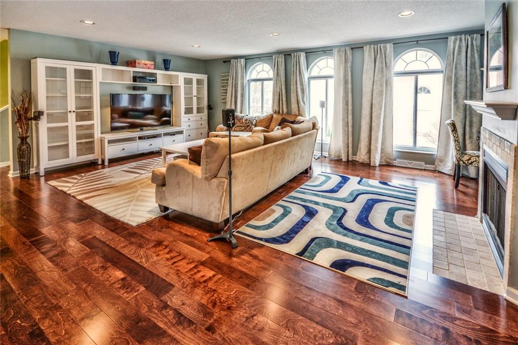 105 Fall Run Road Forest Hills, PA 15221 - Photo 7 of 24 Family room with hardwood floors and a gas burning fireplace