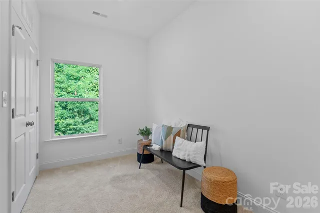 a view of workspace with furniture and a window