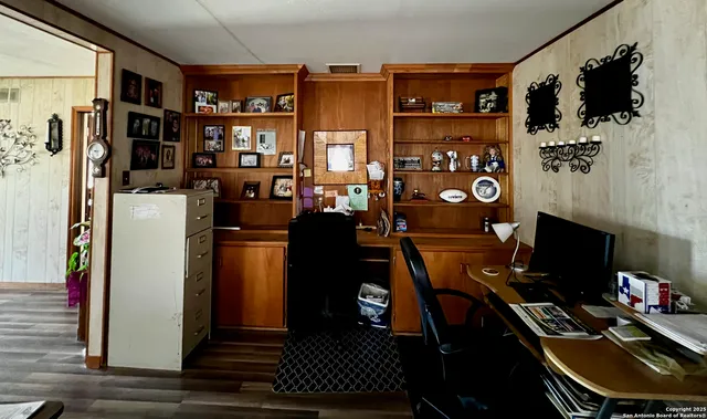 a view of a workspace with furniture