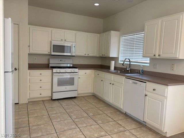 2866 Shimmering Bay Street Laughlin, NV 89029 - Photo 9 of 32 A well-equipped kitchen features ample cabinetry, durable countertops, and tiled flooring.
