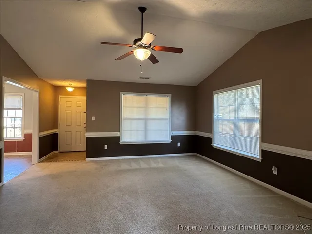 a view of wooden floor and chandelier in a room