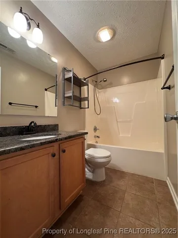 a view of an empty room and a window