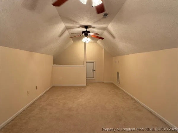 a utility room with cabinets washer and dryer