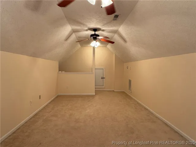 a utility room with cabinets washer and dryer