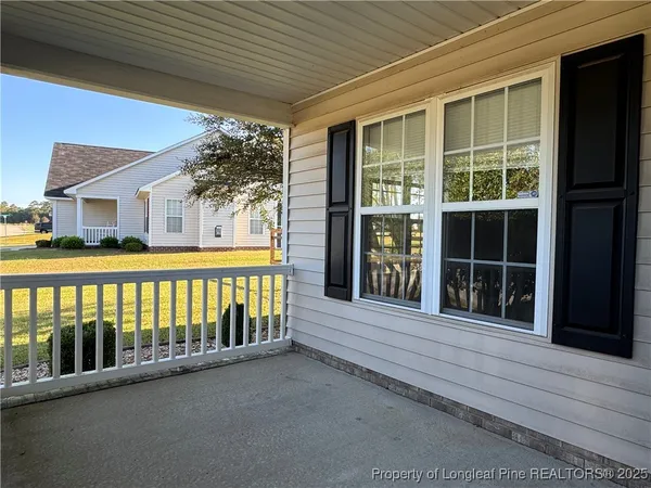 a view of a brick house with a large window