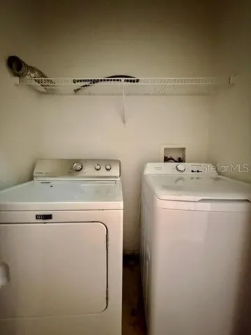 a utility room with dryer and washer
