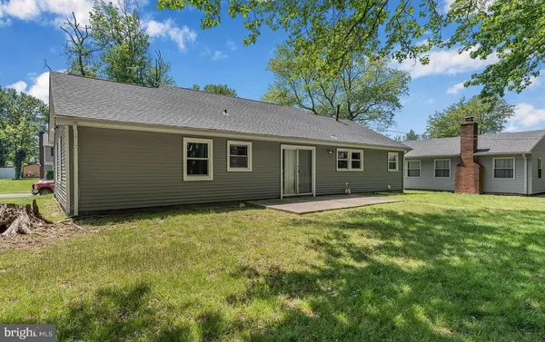 a view of a house and a yard with green space