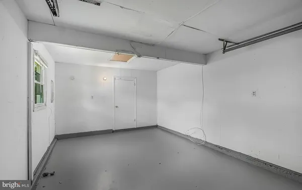 a kitchen with sink cabinets and window